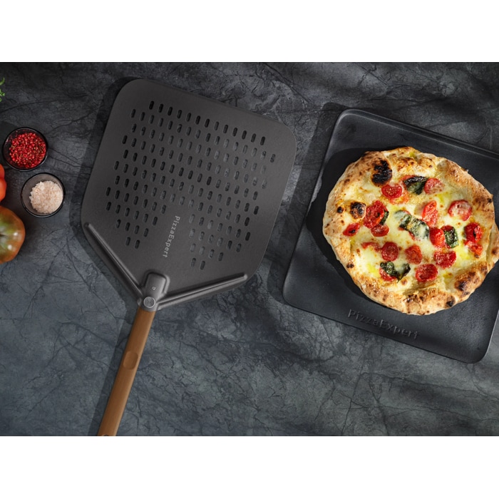 Lifestyle image of cast iron tray and peel