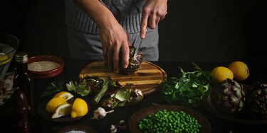 Chopping greens on cutting board